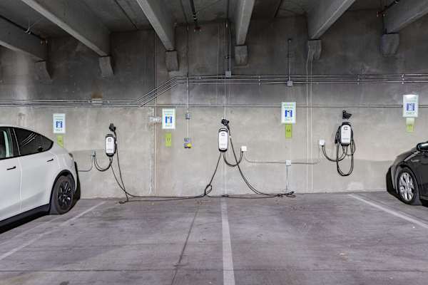 A parking garage with electric vehicle charging stations. at The Revival, Utah, 84101